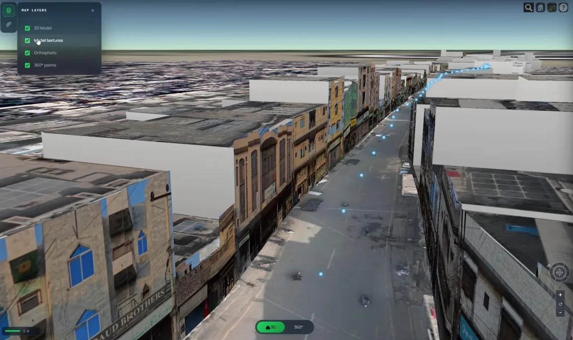 A street captured with OnePass 3D: textured buildings either side of the road, with blue dots marking where each 360° panorama was taken.